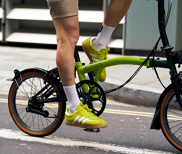 Close up of someone riding a custom 5th Brompton bike