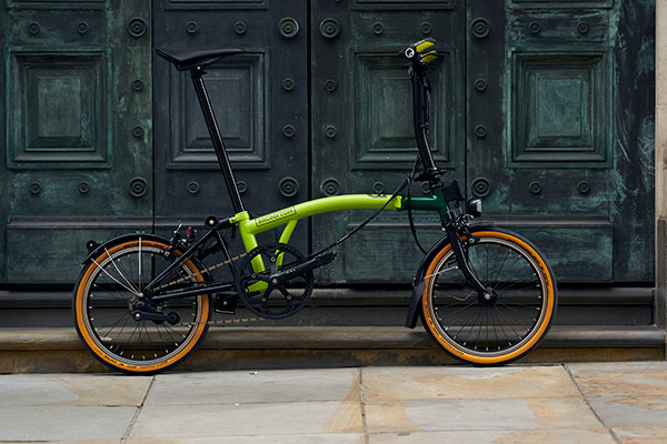 Image of custom 5th Brompton bike against a wall