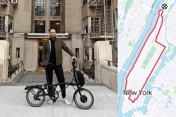 Image of Adeet D., Brompton Electric Owner, with a Brompton bike and image of New York map
