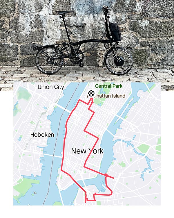 Brompton Electric bike against a wall overlayed with New York City map