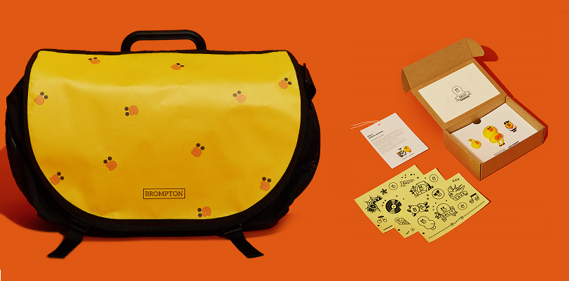 The Sally special edition yellow Brompton collaboration bag with stickers