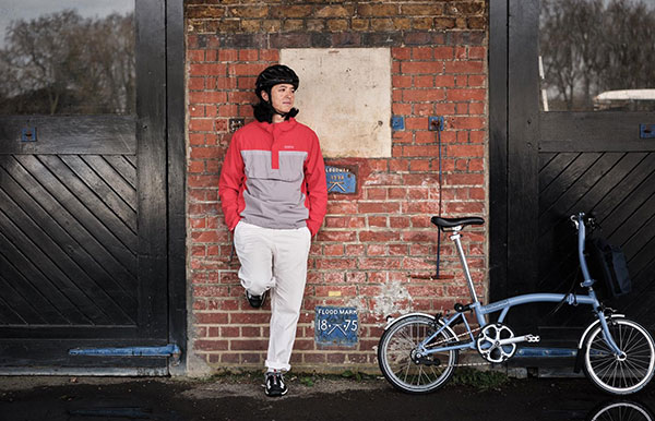 Jun Chan with a Brompton in Endura x Brompton Munich Waterproof Jacket