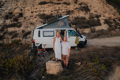 Lennart Pagel and his girlfriend pose in front of their van Gilbert.