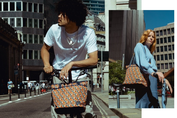 2 people modelling the Liberty x Brompton Tote bags in London