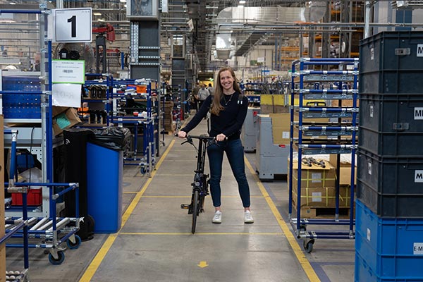 Image of Louisa Holbrook, Head of Sustainability, with a Brompton in the Brompton factory