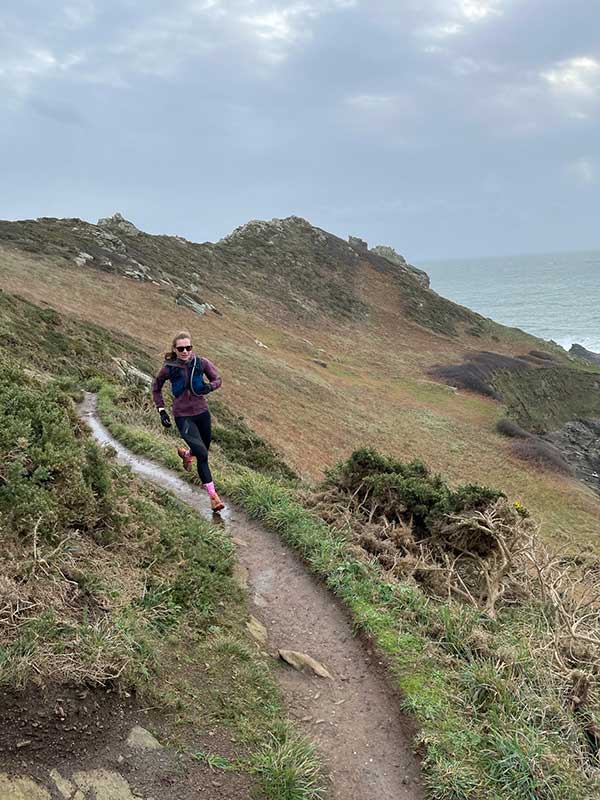 Louisa Holbrook, head of Sustainability at Brompton, running on a hill